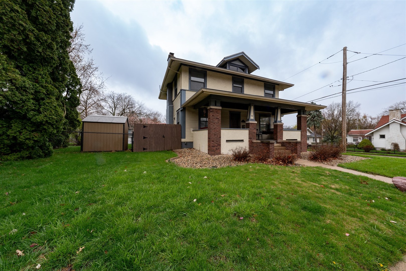 58 White Place Bloomington, IL 61701 - Photo 2 of 38 a front view of a house with garden