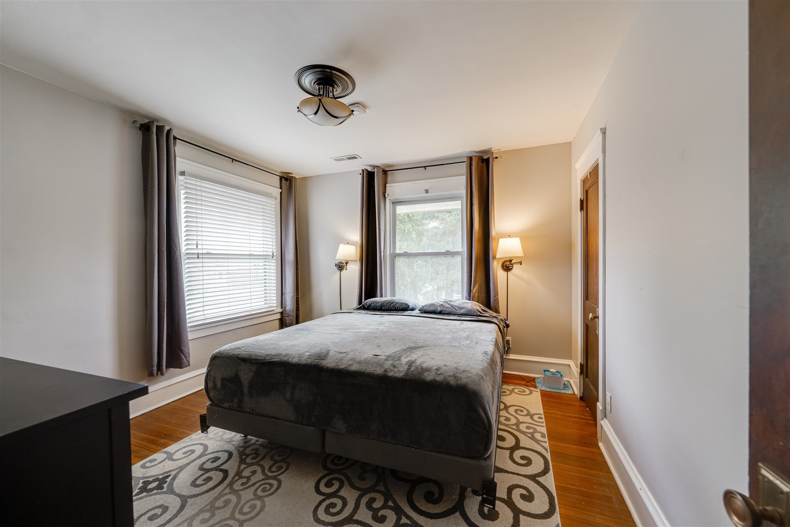 58 White Place Bloomington, IL 61701 - Photo 23 of 38 a bedroom with a bed and wooden floor