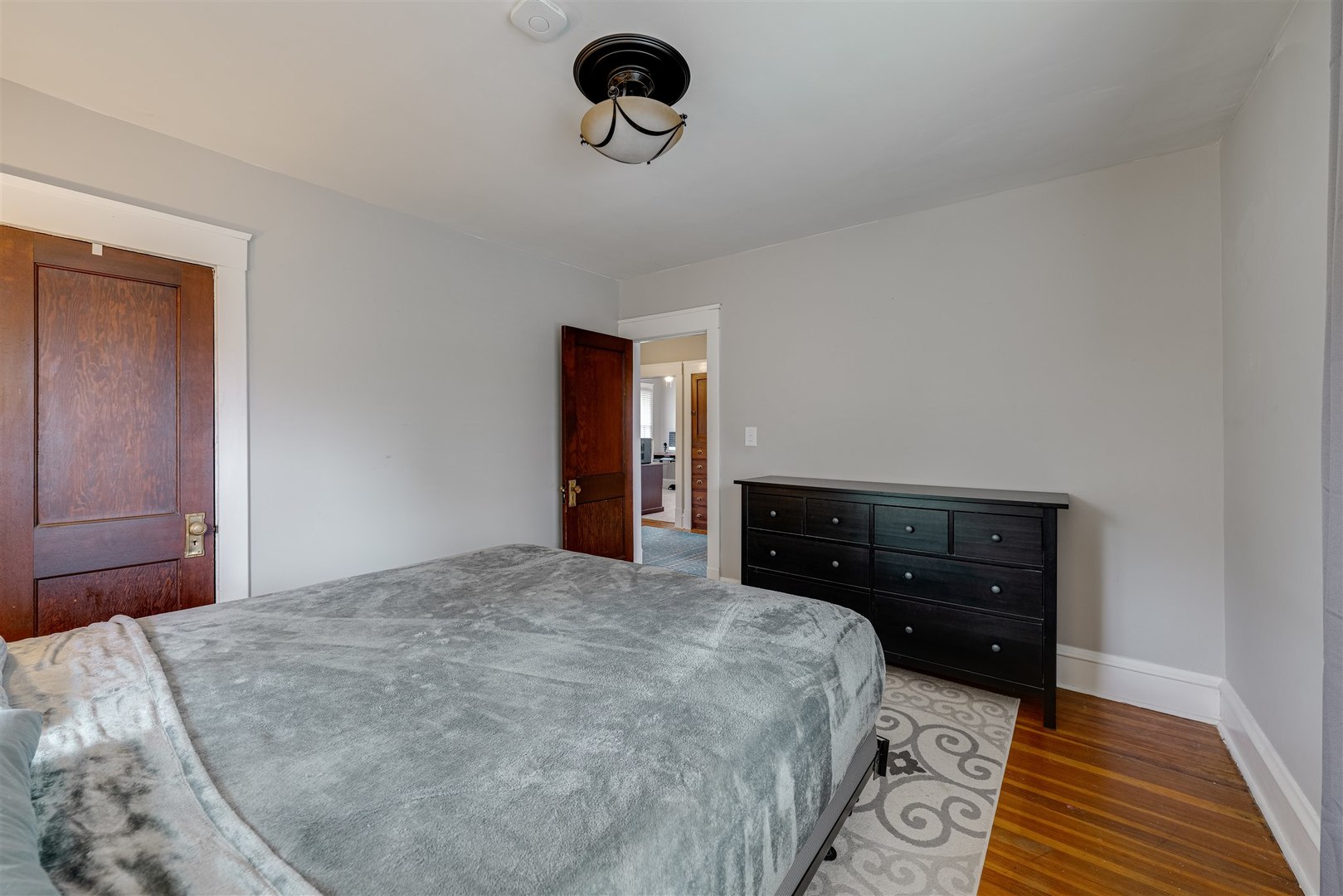 58 White Place Bloomington, IL 61701 - Photo 24 of 38 a bedroom with a bed and a dresser