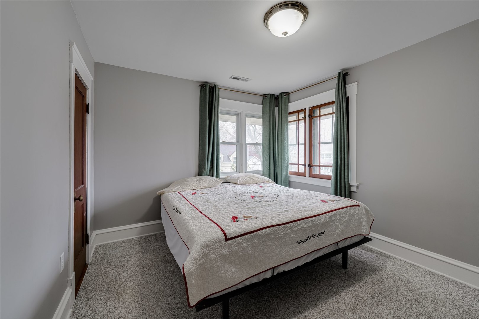 58 White Place Bloomington, IL 61701 - Photo 25 of 38 a bed sitting in a spacious bedroom next to a window