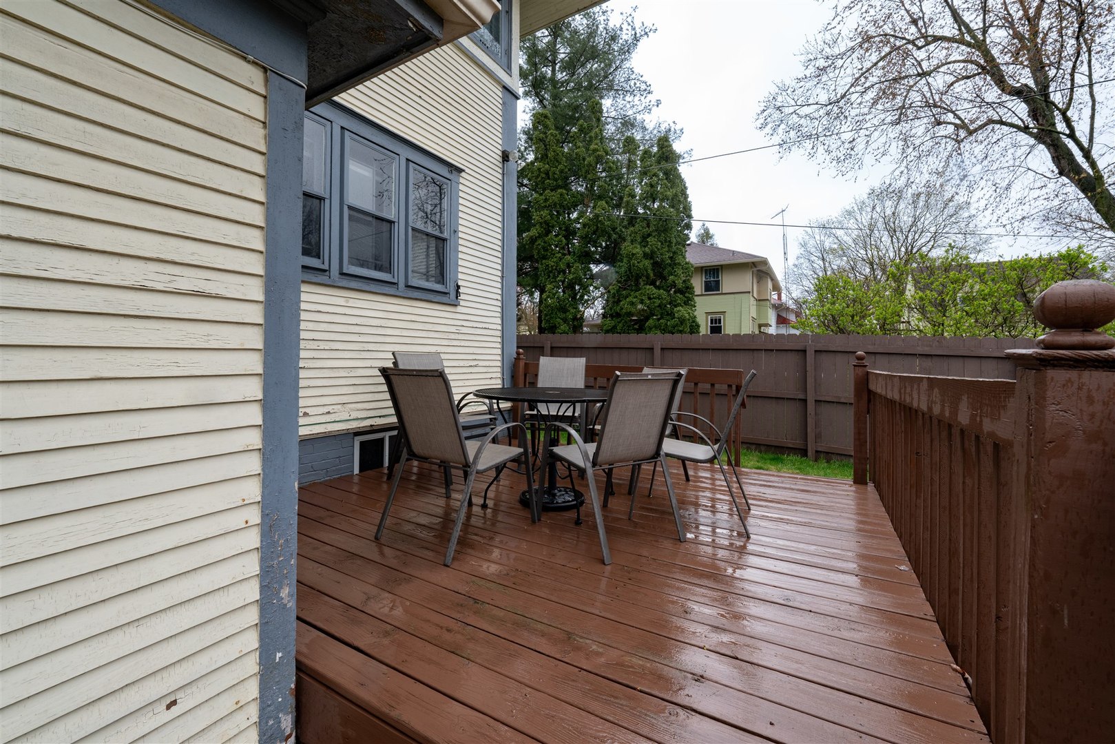 58 White Place Bloomington, IL 61701 - Photo 32 of 38 a view of a roof deck with table and chairs and wooden floor