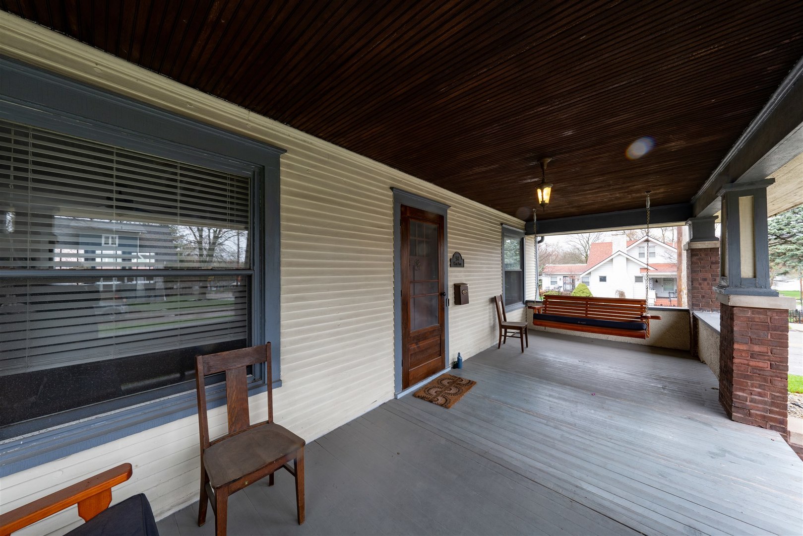 58 White Place Bloomington, IL 61701 - Photo 4 of 38 a view of a porch with furniture and a window