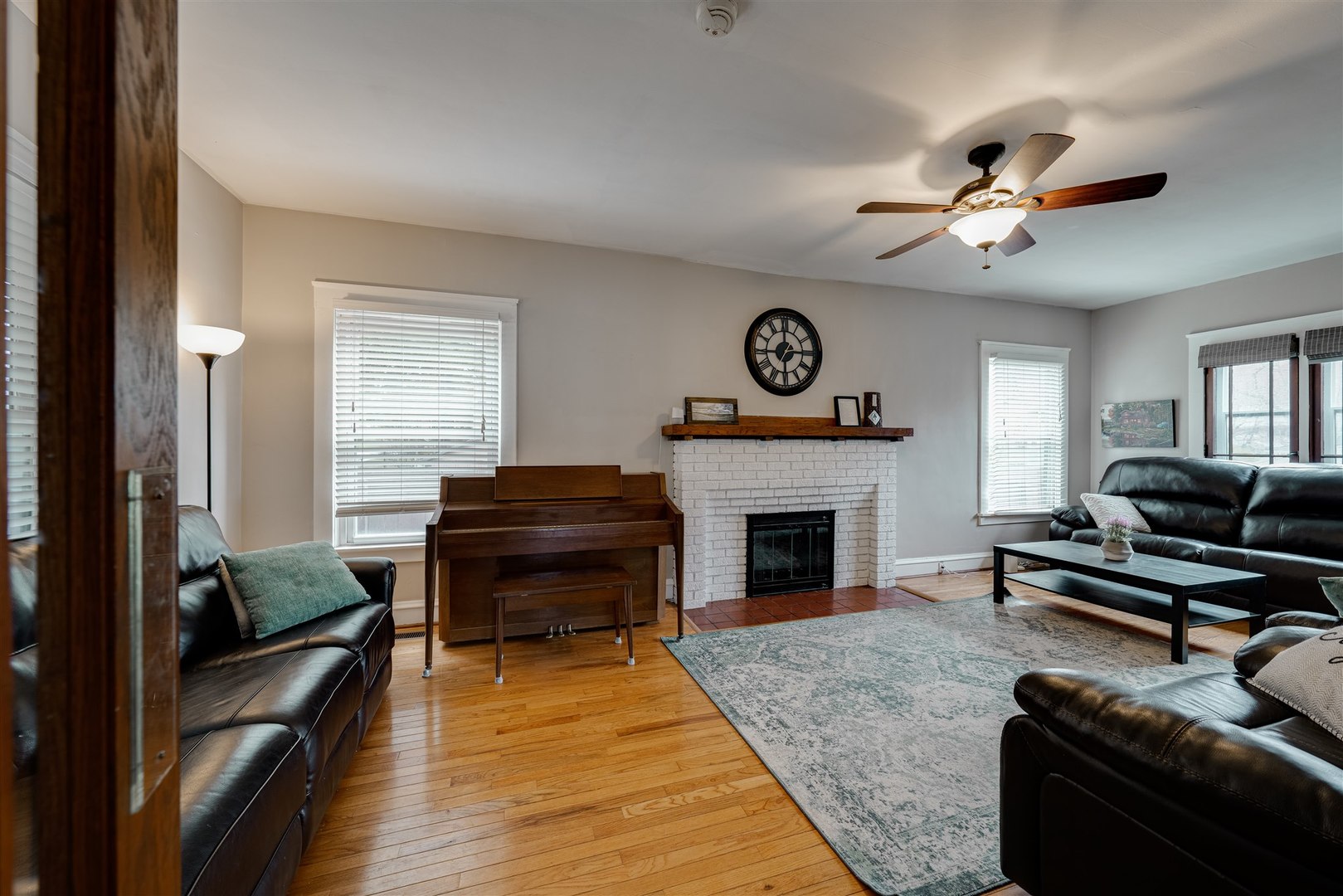 58 White Place Bloomington, IL 61701 - Photo 8 of 38 a living room with furniture a fireplace and a window