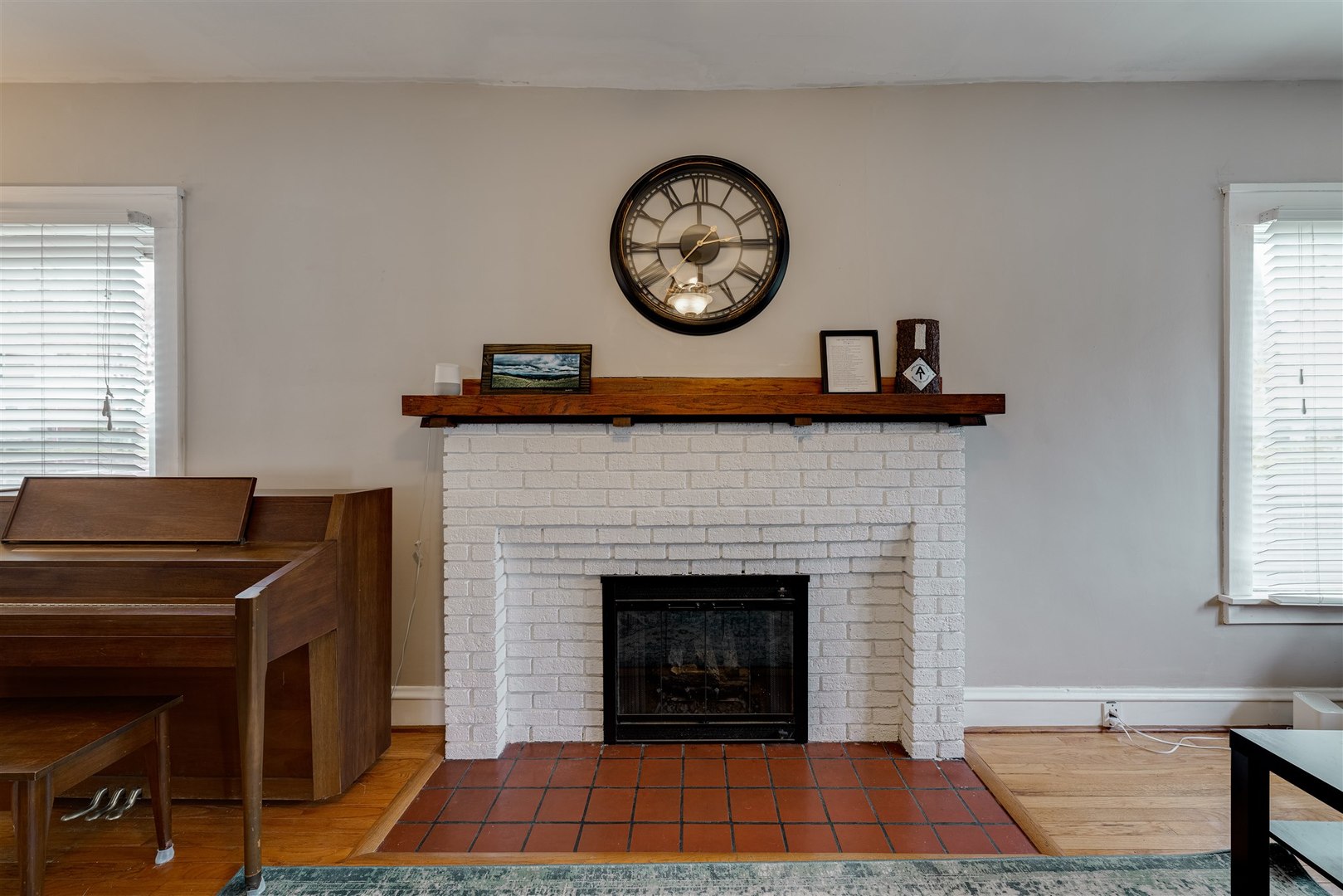 58 White Place Bloomington, IL 61701 - Photo 10 of 38 a living room with a fireplace and a window
