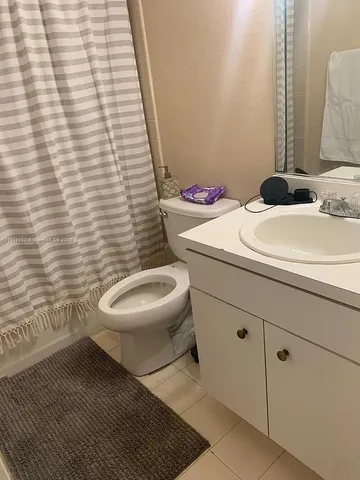 a bathroom with a toilet and a sink