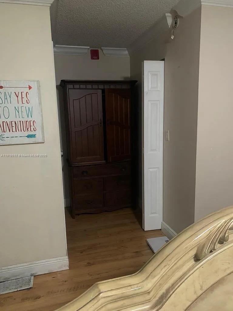 18051 Northwest 68th Avenue, Unit L104 Hialeah, FL 33015 - Photo 9 of 9 a view of walk in closet