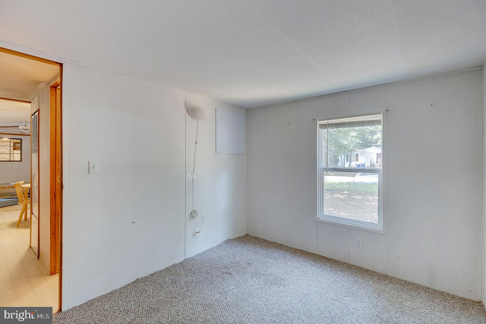 24119 Celtic Street Georgetown, DE 19947 - Photo 18 of 45 an empty room with windows