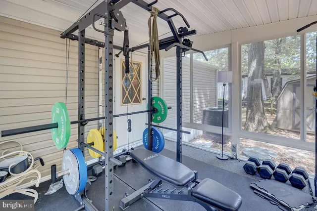 a dining room with furniture and a window