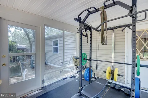 a view of a chair and table on the deck