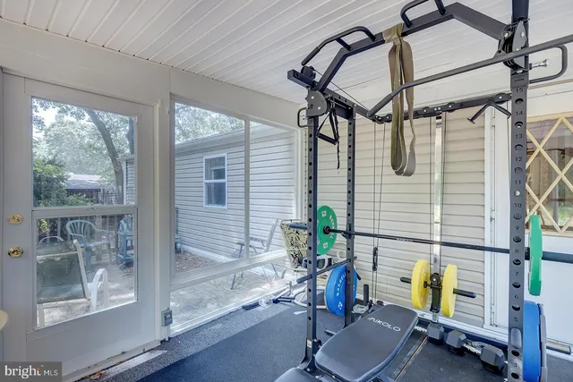 a view of a chair and table on the deck