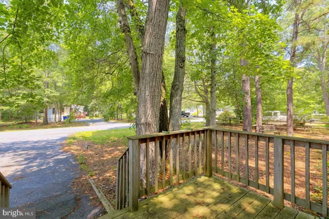 a view of a balcony with wooden floor