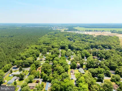 an aerial view of residential building and lake