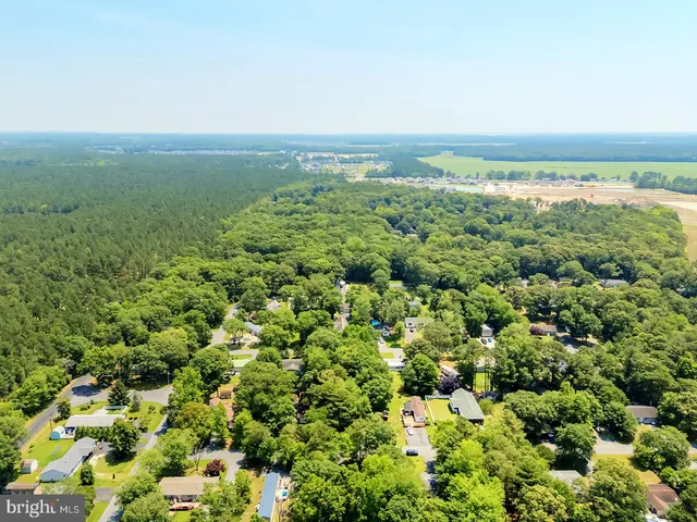 an aerial view of residential building and lake