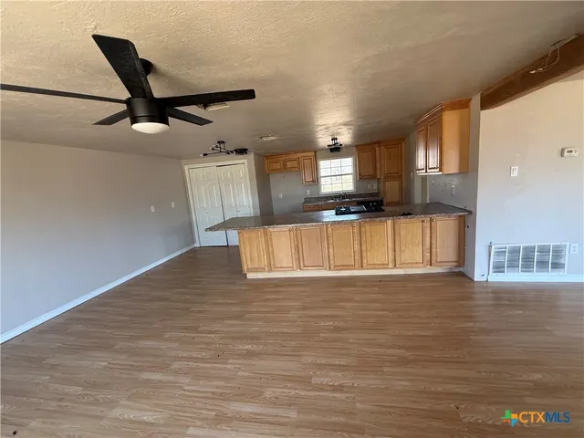 a view of a kitchen with a sink