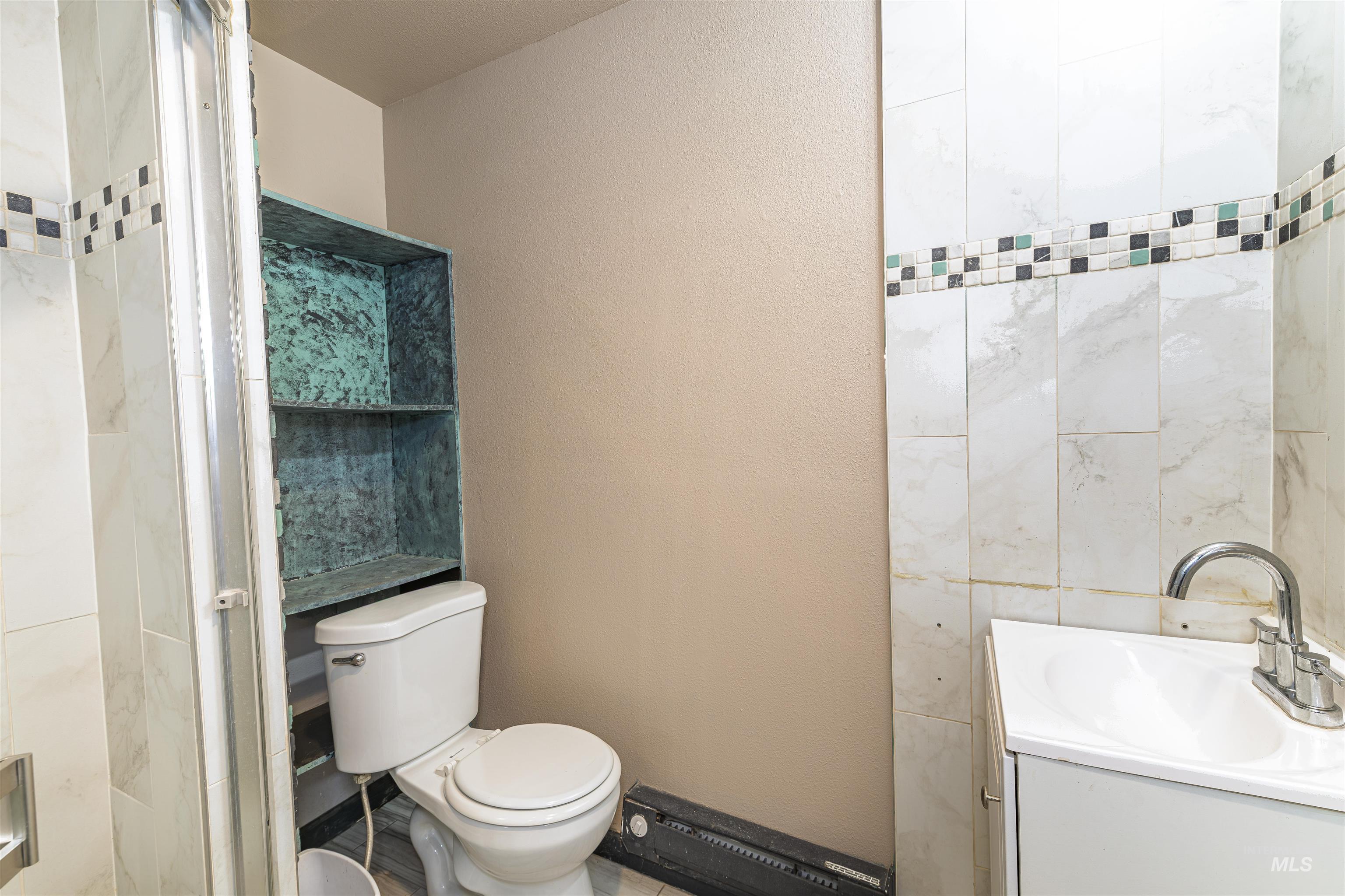 2003 North Cole Road Boise, ID 83704 - Photo 26 of 40 Bathroom featuring vanity and a textured wall
