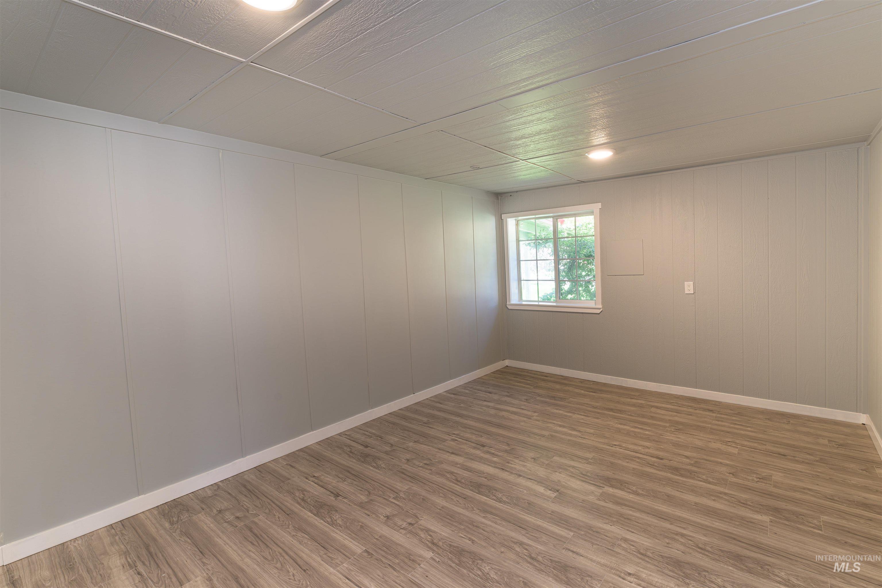 2003 North Cole Road Boise, ID 83704 - Photo 9 of 40 Spare room featuring wood finished floors