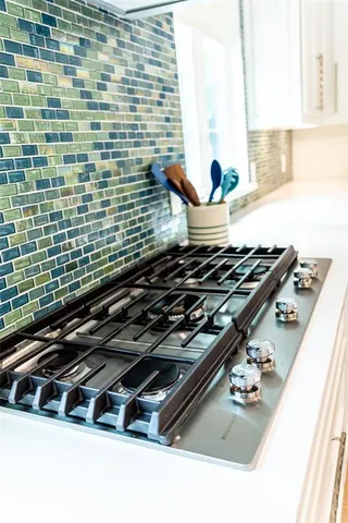 a close up of a stove top oven sitting on a floor