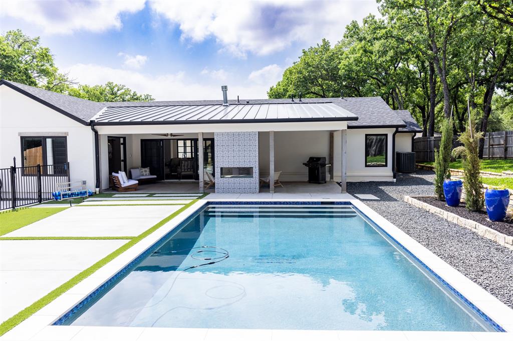 1223 Ridgewood Circle Southlake, TX 76092 - Photo 23 of 24 a view of a house with swimming pool and sitting area