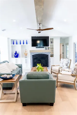 a living room with furniture and a fireplace