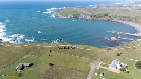 a bathroom with a sink mirror and vanity