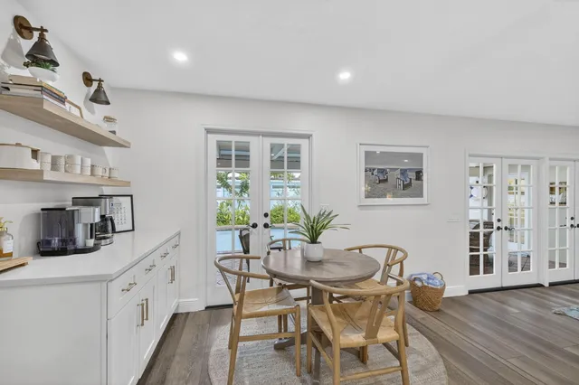 a large kitchen with stainless steel appliances lots of counter space and a sink