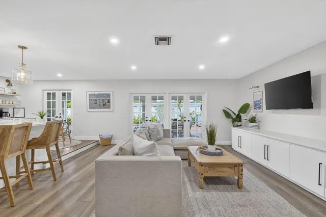 a spacious bedroom with a large bed and a window