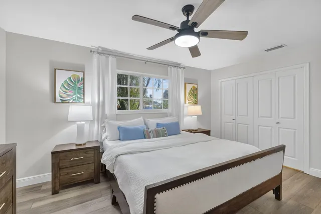 a bathroom with a granite countertop sink toilet a shower and a mirror