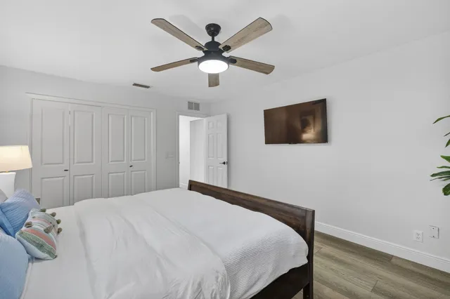 a bedroom with a large bed and a window