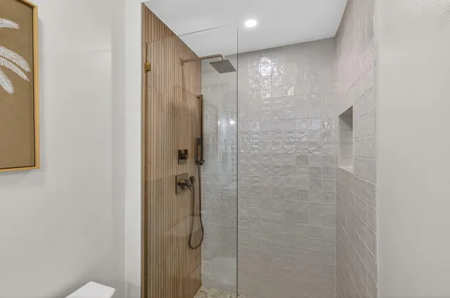 a bedroom with two beds and a window