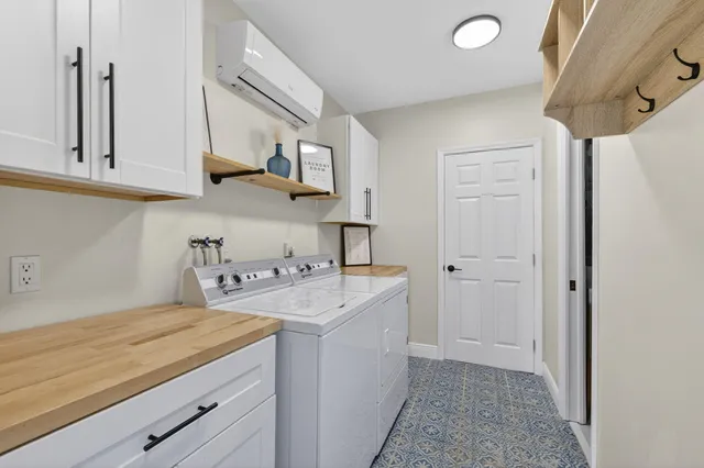 a dining room with furniture and a floor to ceiling window