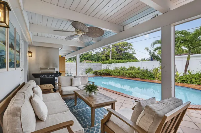 a view of a swimming pool with a patio