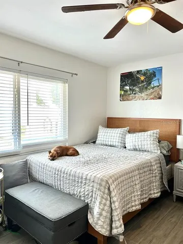 a bedroom with a bed and window