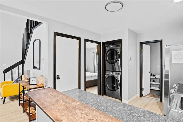 a en suite bathroom with a granite countertop sink and a mirror
