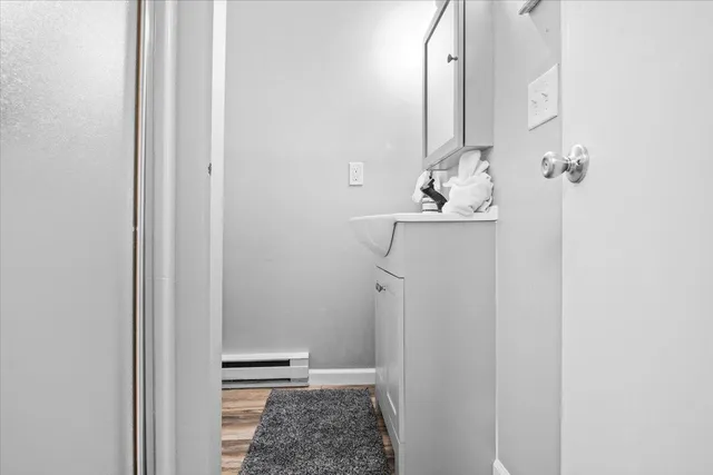 a bathroom with a sink and mirror