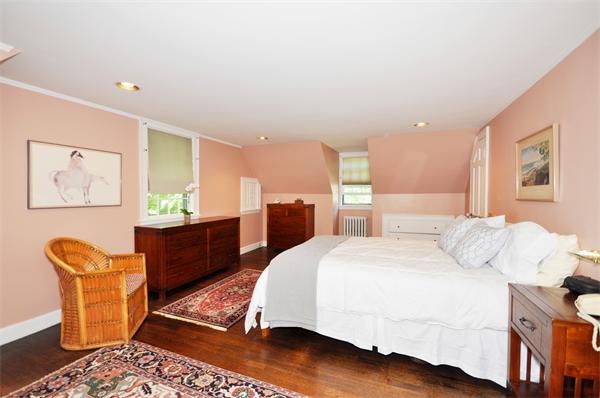 75 Blake Road Brookline, MA 02445 - Photo 12 of 21 a bedroom with a bed and wooden floor