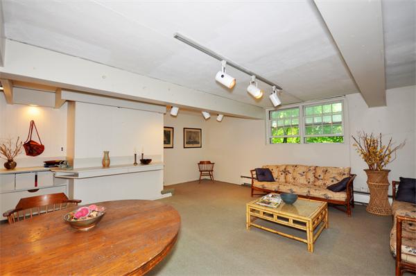 75 Blake Road Brookline, MA 02445 - Photo 17 of 21 a living room with furniture and a table