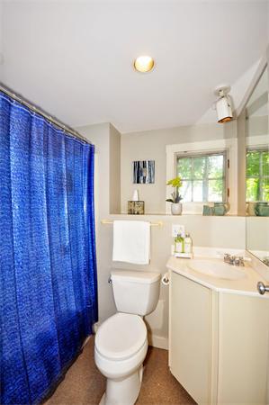 75 Blake Road Brookline, MA 02445 - Photo 19 of 21 a bathroom with a toilet sink vanity and mirror