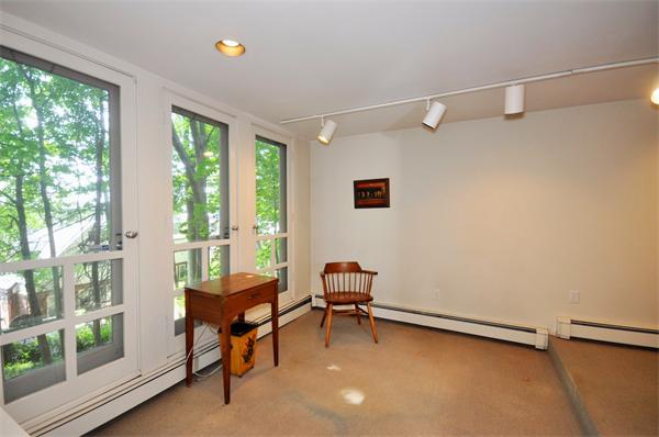 75 Blake Road Brookline, MA 02445 - Photo 20 of 21 a room with furniture and a window