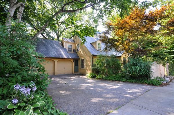 75 Blake Road Brookline, MA 02445 - Photo 21 of 21 a front view of a house with a yard and a tree