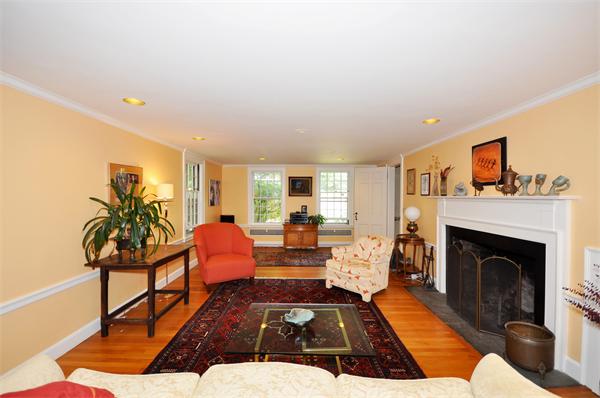 75 Blake Road Brookline, MA 02445 - Photo 4 of 21 a living room with furniture and a fireplace