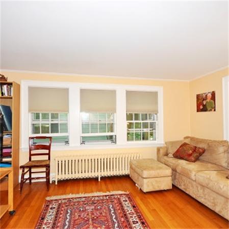 75 Blake Road Brookline, MA 02445 - Photo 5 of 21 a bedroom with furniture and a large window
