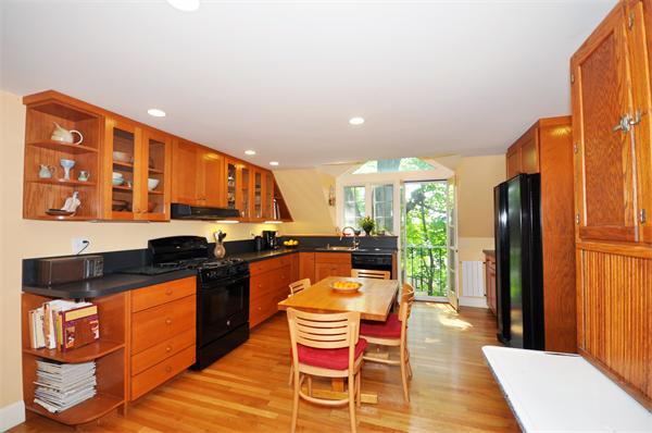 75 Blake Road Brookline, MA 02445 - Photo 7 of 21 a kitchen with stainless steel appliances granite countertop a stove a sink and a refrigerator