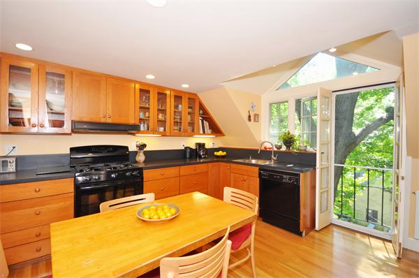 75 Blake Road Brookline, MA 02445 - Photo 8 of 21 a kitchen with stainless steel appliances granite countertop a stove a sink and a microwave