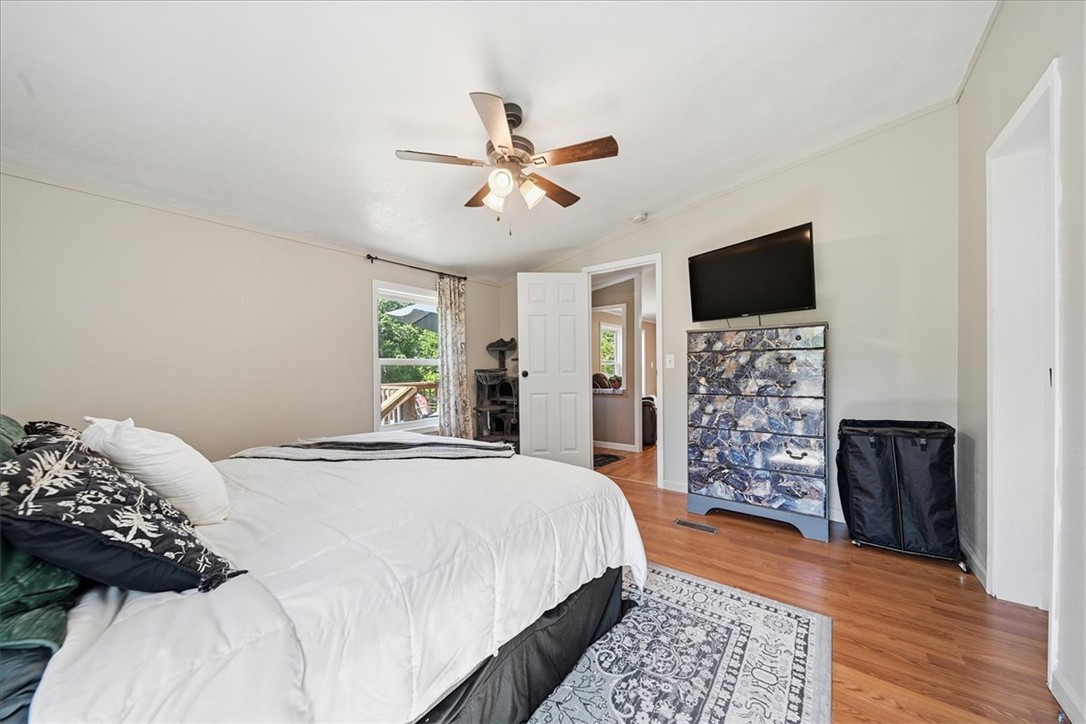 1014 Harris Road Anderson, SC 29625 - Photo 12 of 34 Hardwood floors and a ceiling fan create a comfortable and stylish retreat.