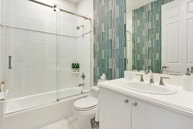 a spacious bedroom with a bed and a couch