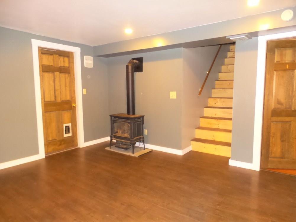 657 Albion Road Benton, ME 04901 - Photo 6 of 31 Family room has propane stove