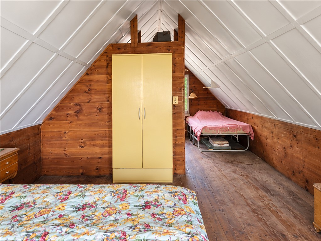 4389 Mickel Parcel A Road Burdett, NY 14818 - Photo 13 of 13 Dorm-Style Upper Sleeping Area Reflecting the Cottage’s Original Character – AI Enhanced for Light