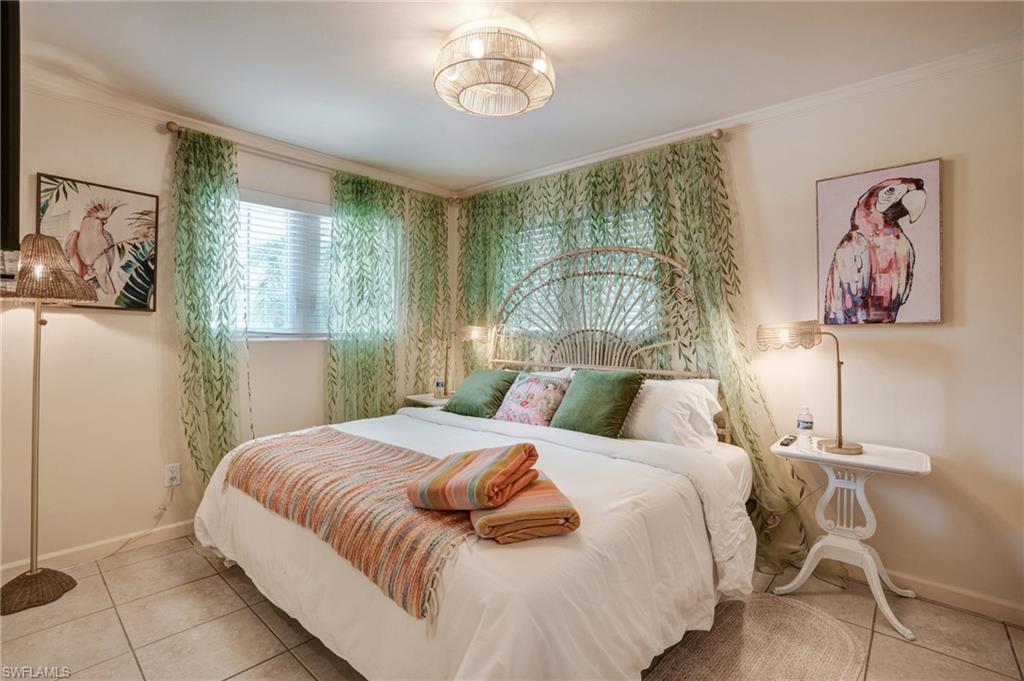 7146 Congdon Road Fort Myers, FL 33908 - Photo 22 of 50 a bedroom with a bed and a painting on the wall