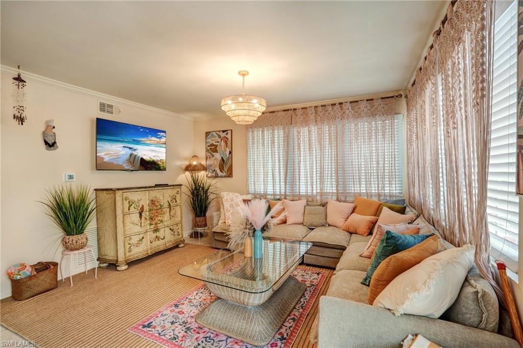 7146 Congdon Road Fort Myers, FL 33908 - Photo 23 of 50 a living room with furniture and a flat screen tv