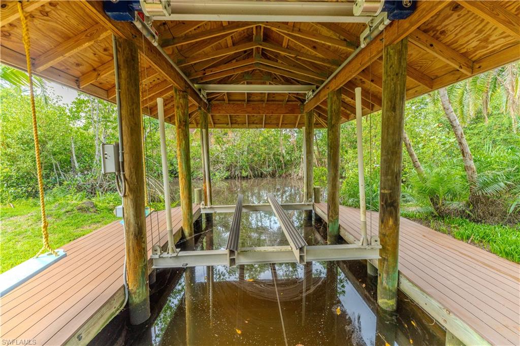 7146 Congdon Road Fort Myers, FL 33908 - Photo 26 of 50 a view of a balcony with chairs and wooden floor